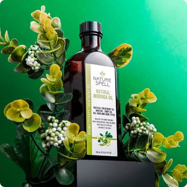 Maya and Tzvi with Moringa plants